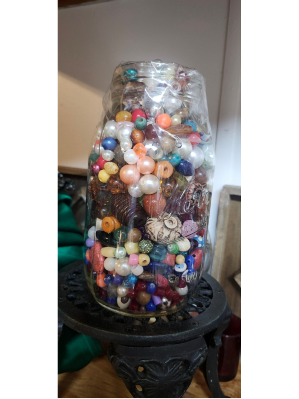 Jar of wooden beads and Plastic beads